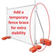 Temporary fence brace with orange stabilizing bases for enhanced stability and support in construction areas.