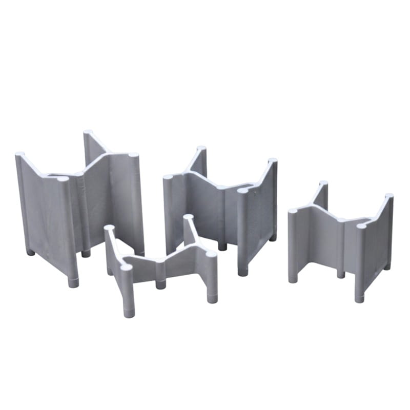 Set of four gray plastic corner brackets for secure shelving and organization.