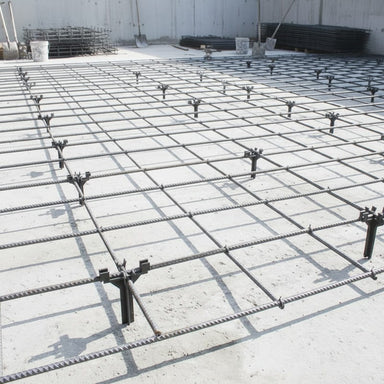 Concrete reinforcement mesh grid, black steel rebar, used for construction, providing structural support.