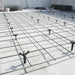 Concrete reinforcement mesh grid, black steel rebar, used for construction, providing structural support.