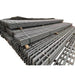 Heavy-duty steel rebar mesh sheets, gray color, ideal for construction and reinforcement applications.